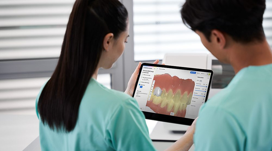 CER_FemaleAssistantandMakeDentisLookingAtTabletInfrontofCERECGo